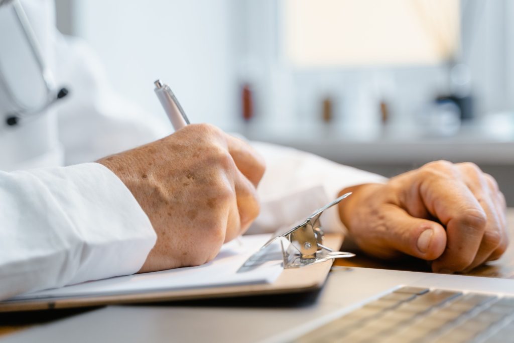 Medical professional reviewing a care plan with a patient