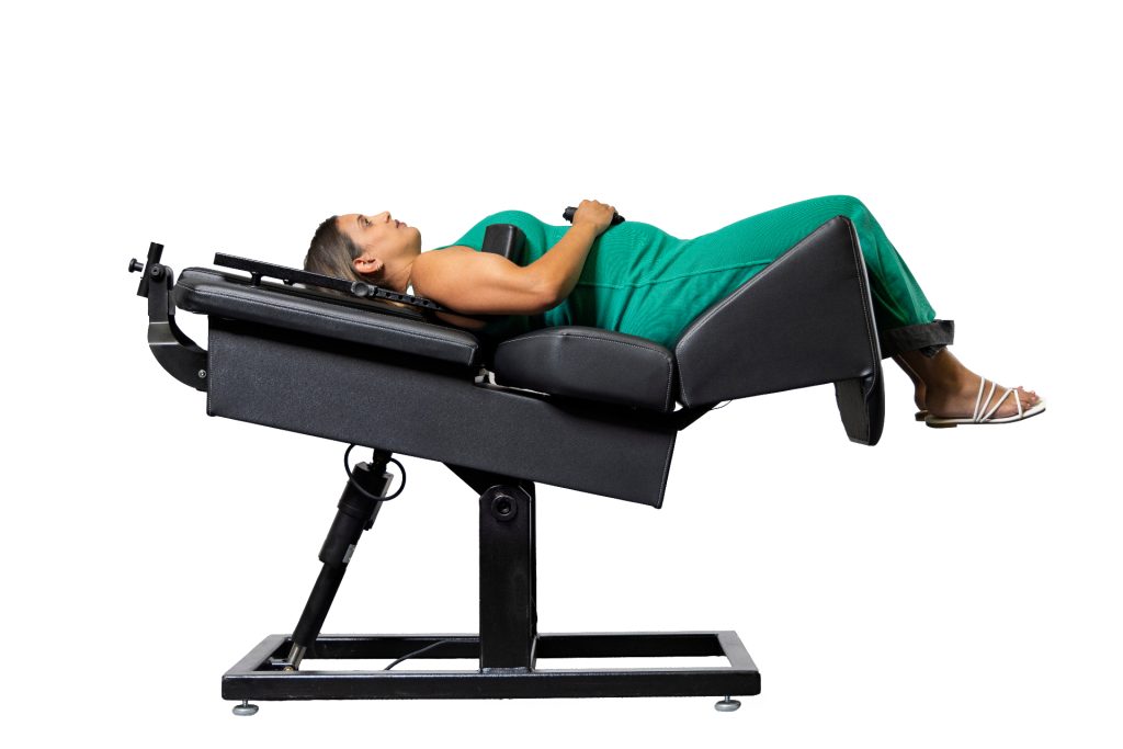 Patient positioned on a Back on Trac spinal decompression system