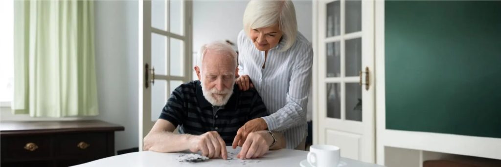 Older adults reviewing recovery information at home
