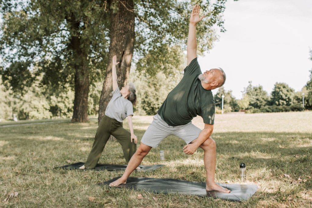 Adult practicing an outdoor mobility exercise