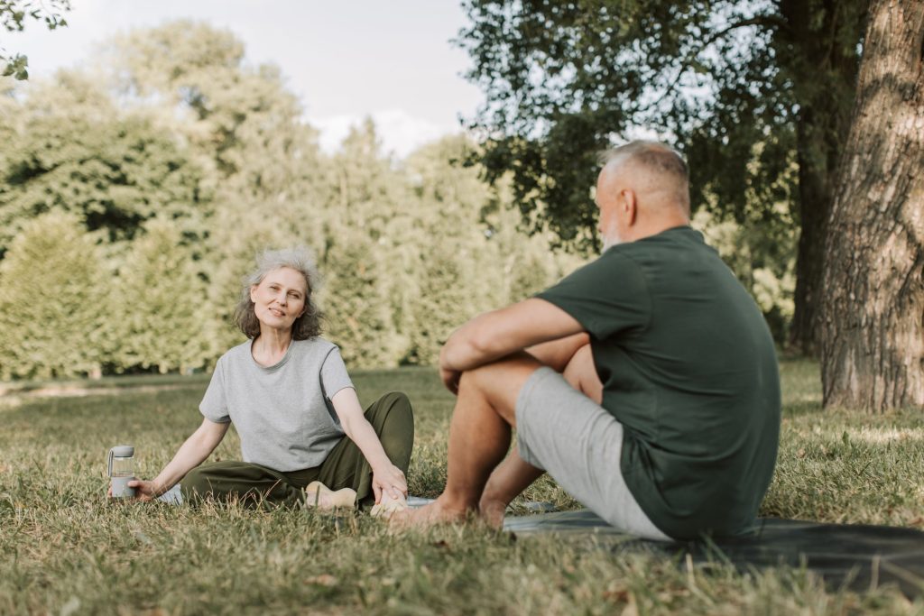 Adults discussing wellness goals after outdoor activity