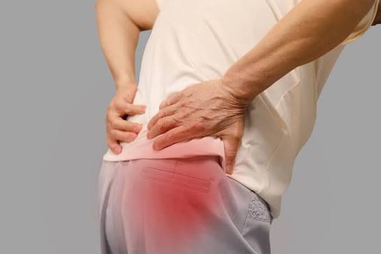 Clinician evaluating hip mobility and movement
