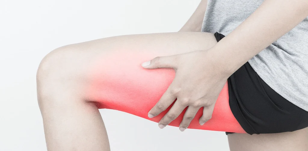 Clinician evaluating leg movement and function